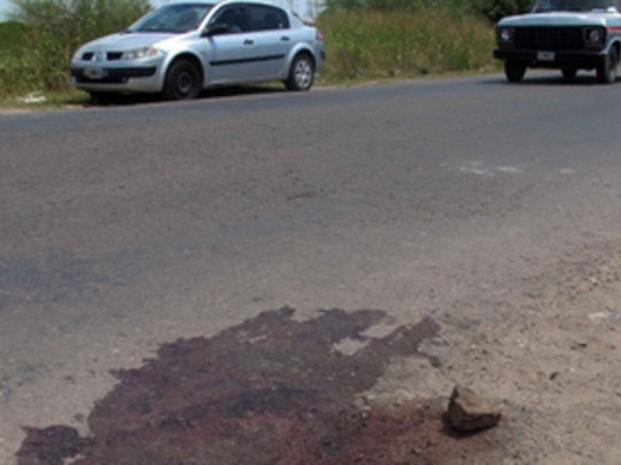 La sangre sobre San Martín marca el lugar donde cayó muerto Eugenio Daniel Díaz, tras recibir seis b